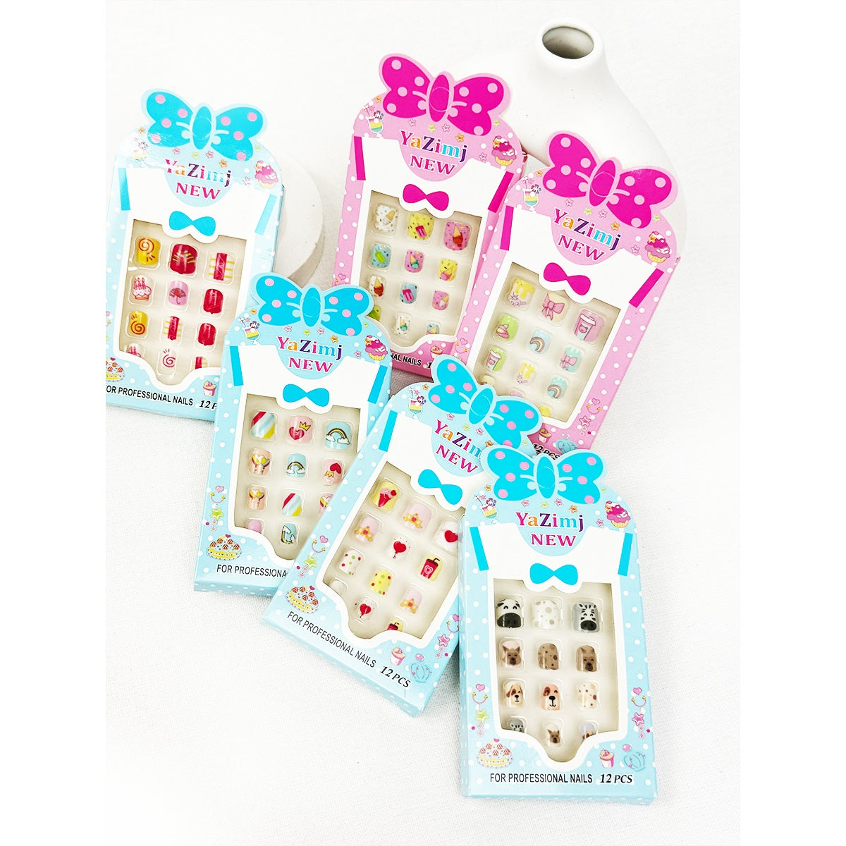Two Love and Repeat kids press-on nail sets with bright assorted designs