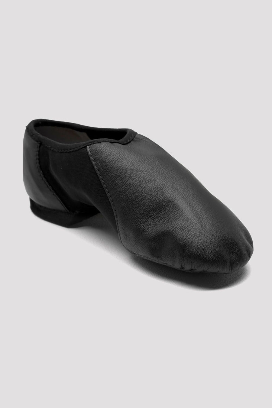 Single black slip-on leather jazz shoe angled slightly to the side on a white background.