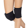 Model wearing black Eurotard knee pads on both knees