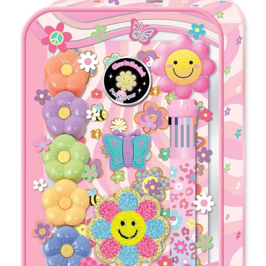 A pink floral-themed school backpack or organizer case decorated with colorful flowers, butterflies, smiley faces, and a pen loop, shown on a plain white background.