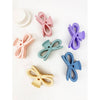 Pastel bow hair claw clips shown in multiple colors arranged side by side
