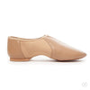 Side view of tan adult slip-on jazz shoe showing low-profile sole