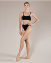 Adult dancer wearing seamless high cut dance briefs, styled with a dance bra, full body view.