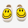 Top view of yellow smiley face slippers with rounded toe design