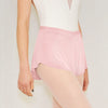 Adult ballet dancer wearing a light pink pull-on ballet skirt over a leotard