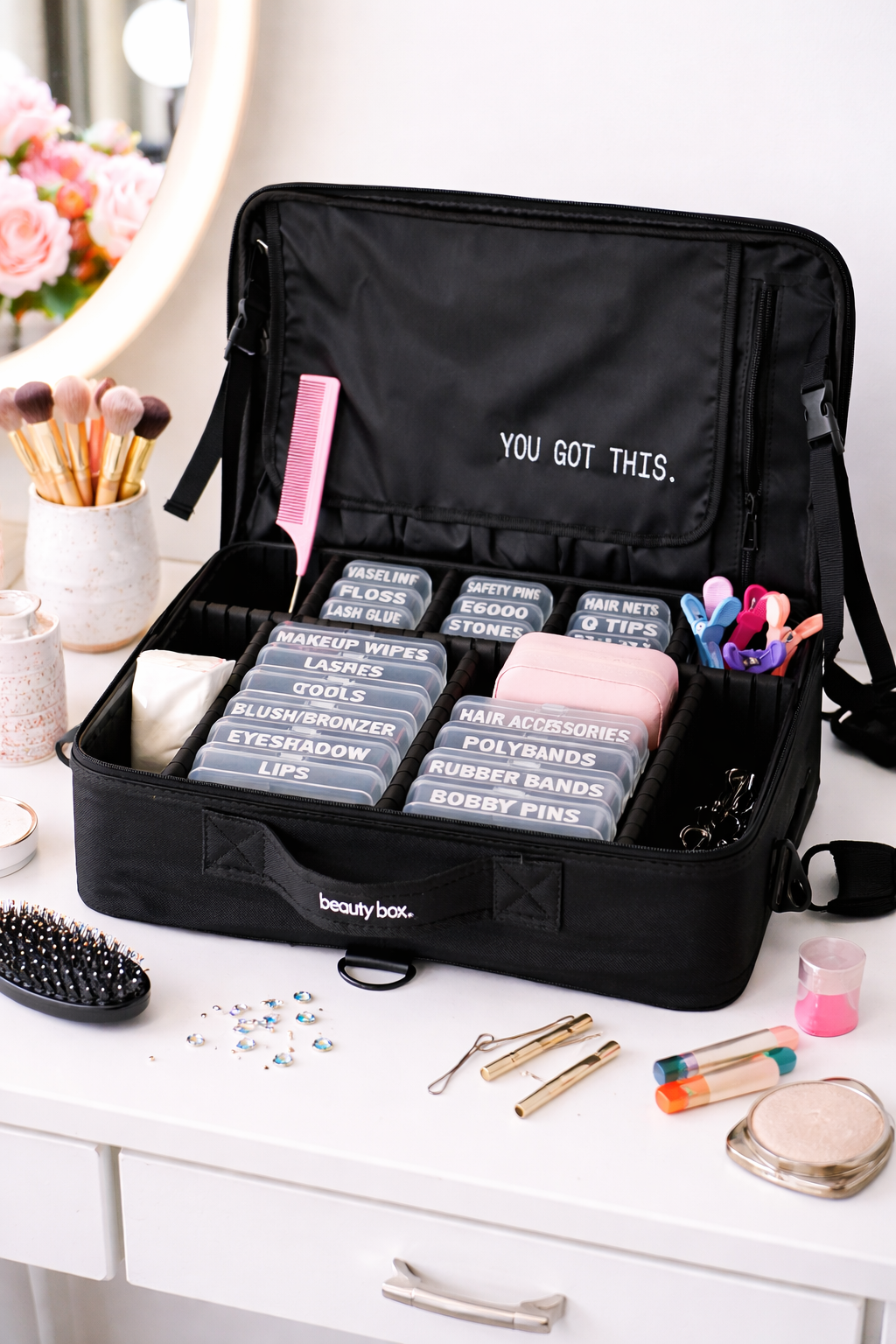 Beauty box displayed open on a table with organized containers and tools visible