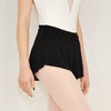 Adult ballet dancer wearing a black pull-on ballet skirt over a leotard