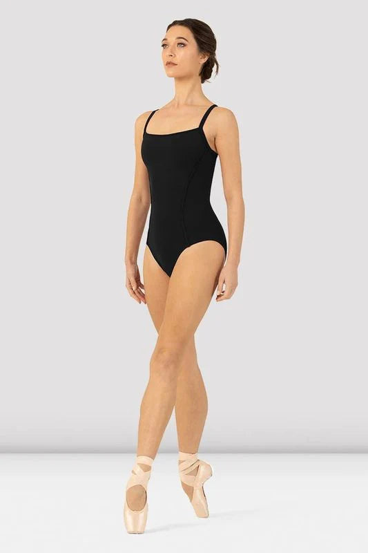 Girl dancer wearing a black scoop-neck cami leotard, front view, standing en pointe
