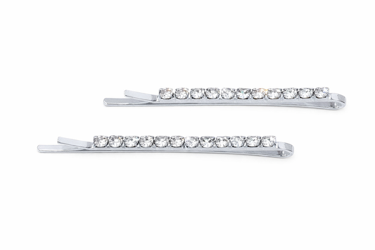 Pair of silver rhinestone single row bobbie pins on a white background