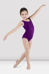 Child dancer wearing purple tank leotard posing with arm raised