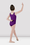Child dancer wearing purple tank leotard posing with arm raised