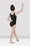 Child dancer wearing black tank leotard posing with arm raised