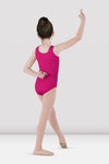Child dancer wearing bright pink tank leotard posing with arm raised