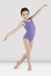 Child dancer wearing lavender tank leotard standing in ballet pose