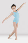 Child dancer wearing pastel blue tank leotard posing in ballet stance
