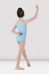 Child dancer wearing pastel blue tank leotard posing in ballet stance