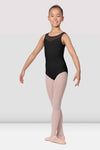 Young dancer wearing a black tank leotard with mesh bodice and scoop neckline