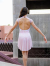Back view of adult dancer wearing apricot mesh ballet skirt