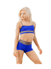 Young dancer wearing blue cheetah-print dance shorts with a matching top against a white background.