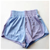 Bluebell colored flowy dance shorts laid flat.
