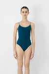 Adult model wearing a camisole leotard with mesh wrap-back detail, shown from the front.