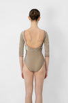 Adult model wearing neutral 3/4 sleeve leotard shown from the front.