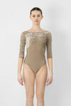 Adult dancer wearing a 3/4 sleeve leotard in Misty Rose with boat neckline, shown from the front.
