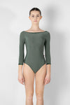 Adult model wearing green 3/4 sleeve leotard shown from the front.