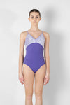 Model wearing purple camisole leotard front view