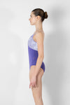 Model wearing purple camisole leotard side view