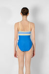 Model wearing blue and yellow camisole leotard back view
