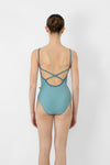 Child model wearing a teal camisole leotard, shown from the back.