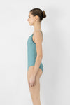Child model wearing a teal camisole leotard, shown from the side.