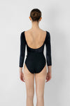 Adult model wearing black 3/4 sleeve leotard shown from the back.