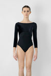 Adult model wearing black 3/4 sleeve leotard shown from the front.