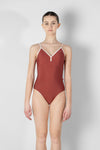 Model wearing red camisole leotard front view