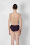 Adult model wearing a dark tank leotard with mesh back, shown from the back.