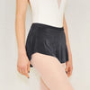 Adult ballet dancer wearing a charcoal pull-on ballet skirt over a leotard