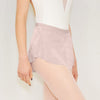 Adult ballet dancer wearing a pale blush pull-on ballet skirt over a leotard