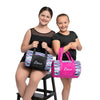 Two young dancers sitting together holding a pink striped sequin dance duffel bag