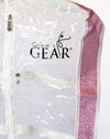 Close-up of a clear garment bag with Glam’r Gear branding and pink trim.