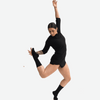 Dancer wearing black knee-high performance dance socks in motion