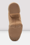 Sole view of a tan slip-on leather jazz shoe showing the split sole.