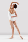 Dancer wearing white camisole leotard posing