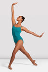 Dancer wearing turquoise camisole leotard in dance pose