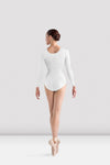 Adult dancer wearing white long-sleeve leotard, studio pose
