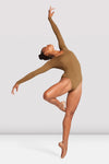 Adult dancer wearing nude long-sleeve leotard, dance movement pose