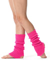 Bright pink 40 cm knit legwarmers worn over bare feet, scrunched at the ankles.