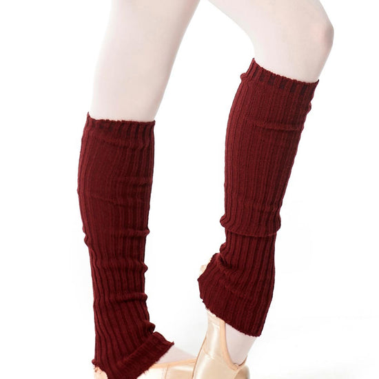 Burgundy knit leg warmers worn over tights and ballet shoes.