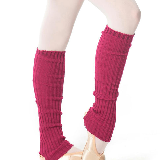 Fuchsia long leg warmers worn over ballet slippers.
